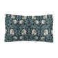 Pillow sham with a floral design inspired by William Morris in a slate blue color on a white background.