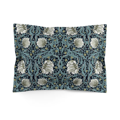 Pillow sham with a floral design inspired by William Morris in a slate blue colour on a white background.
