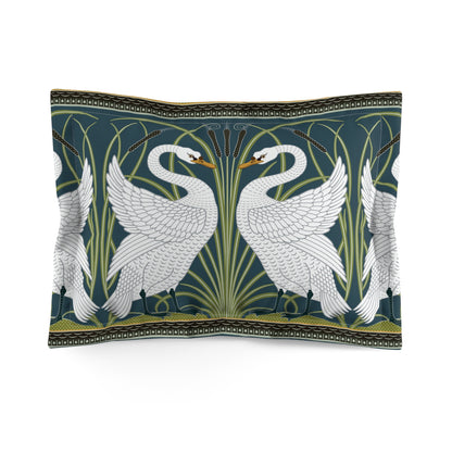 Decorative pillow with swan design on a dark green background