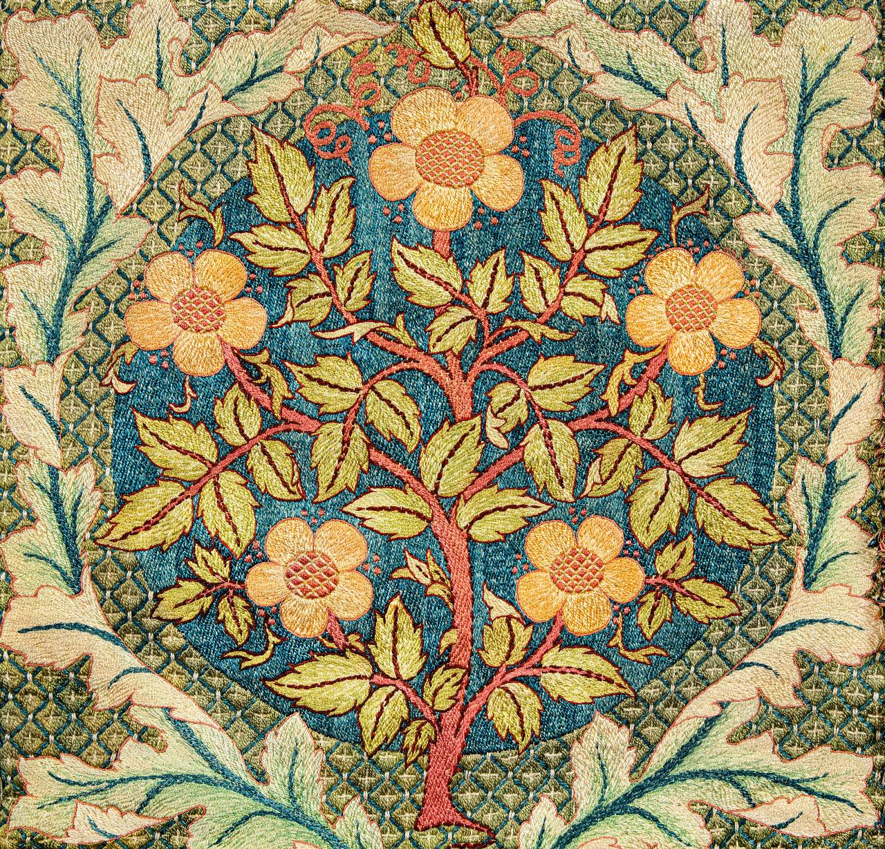 A folded pillow sham with a floral design inspired by William Morris.