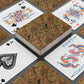 Playing cards with decorative designs on a textured surface