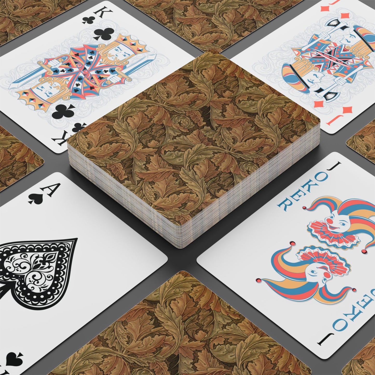 Playing cards with decorative designs on a textured surface