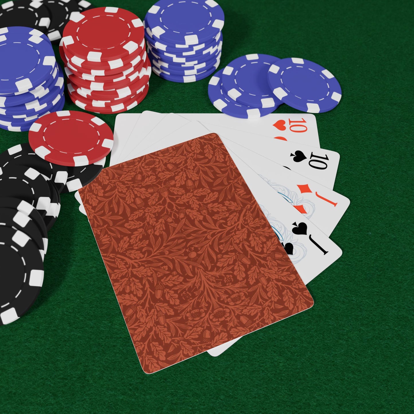 Poker chips and cards on a green felt surface
