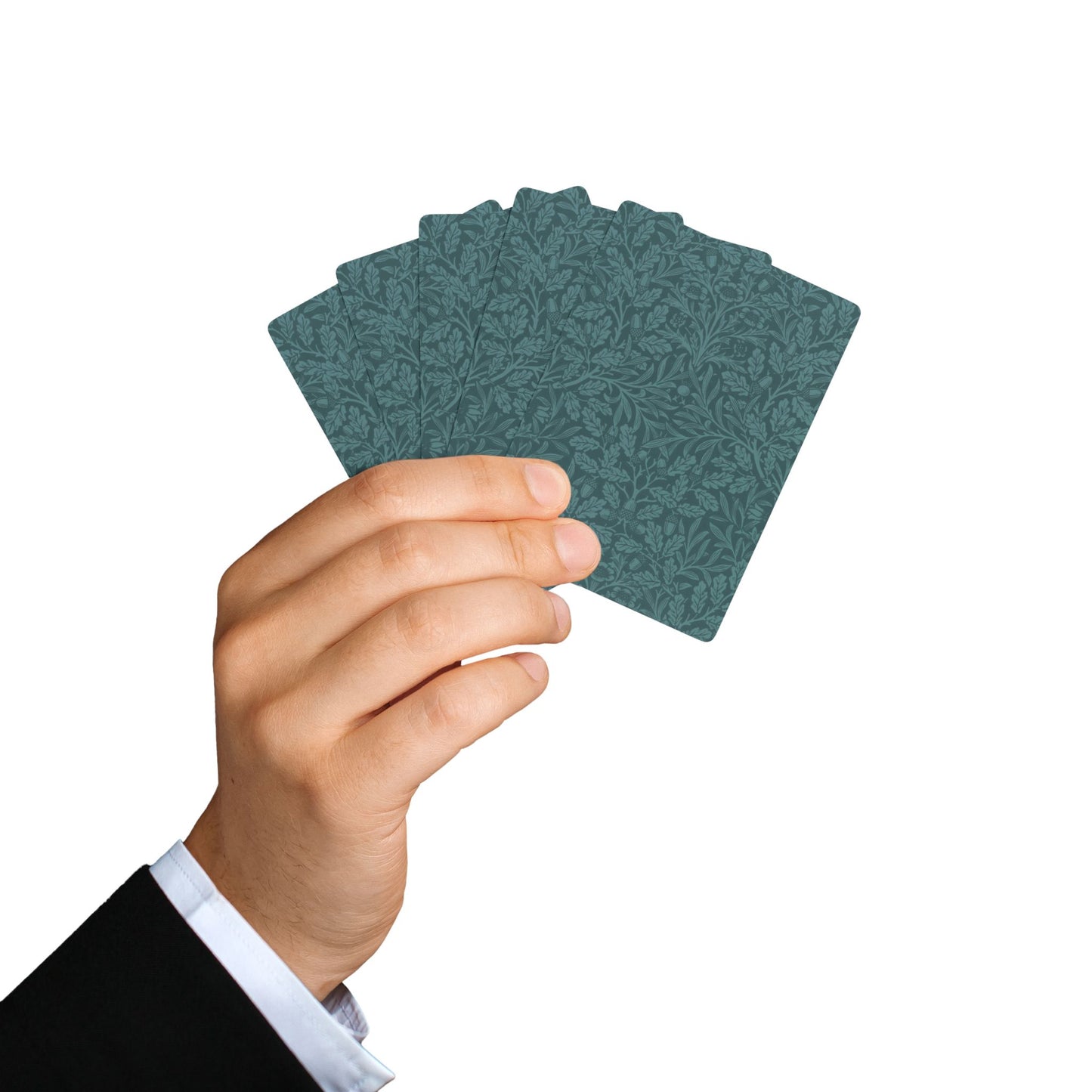 Hand holding a stack of green playing cards against a white background