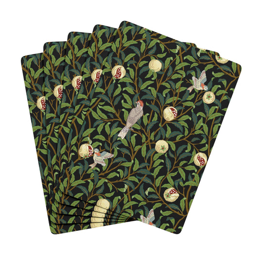 Set of four patterned napkins with birds and foliage design on a white background