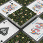 Playing cards with decorative designs on a black surface