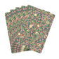 Set of four patterned paper napkins with birds and leaves on a pink background