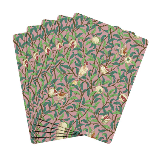 Set of four patterned paper napkins with birds and leaves on a pink background
