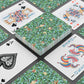 Playing cards with floral and colorful designs on a black surface