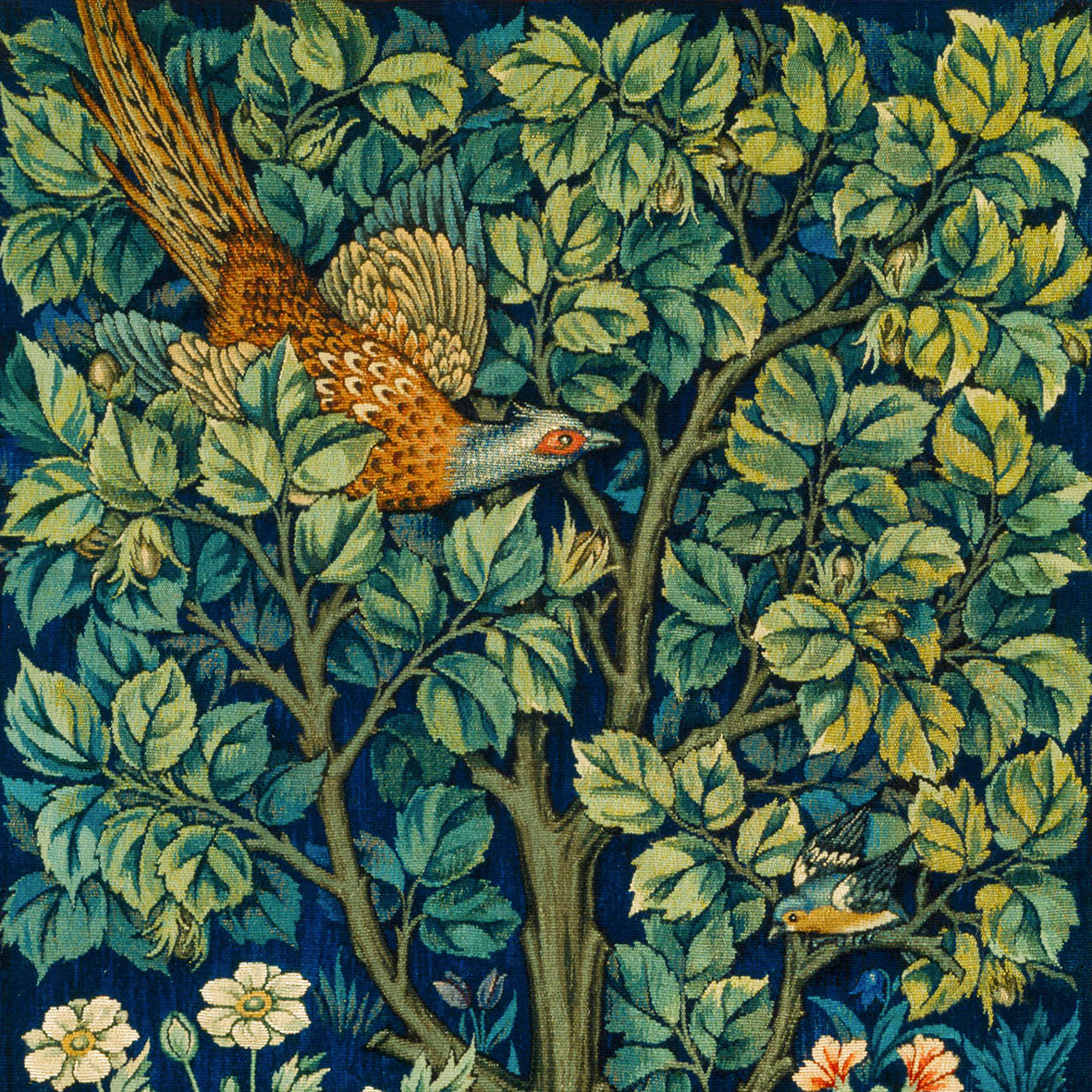 Decorative fabric with a bird and floral pattern on a blue background