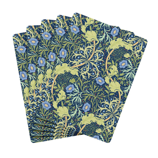 Set of four floral-patterned napkins on a white background