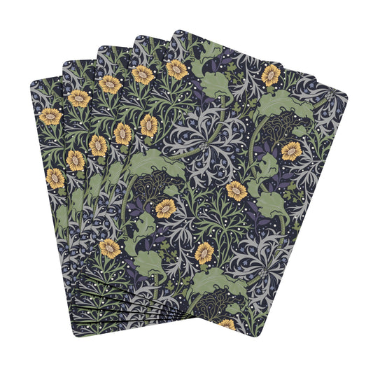 Set of four patterned napkins with floral and nature design on a white background