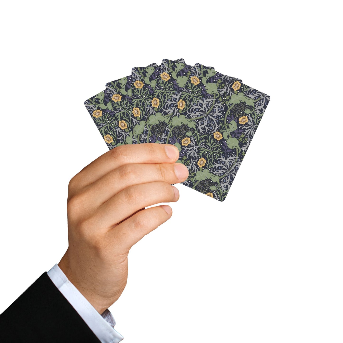 Hand holding a deck of playing cards with a floral design on a white background
