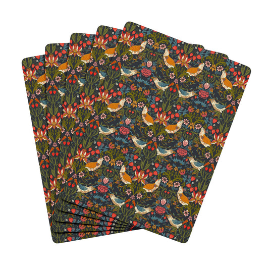 Set of floral and bird patterned playing cards on a white background