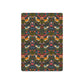 Patterned playing cards with birds and flowers on a dark background