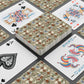 Playing cards with floral design and colorful joker card on a dark surface