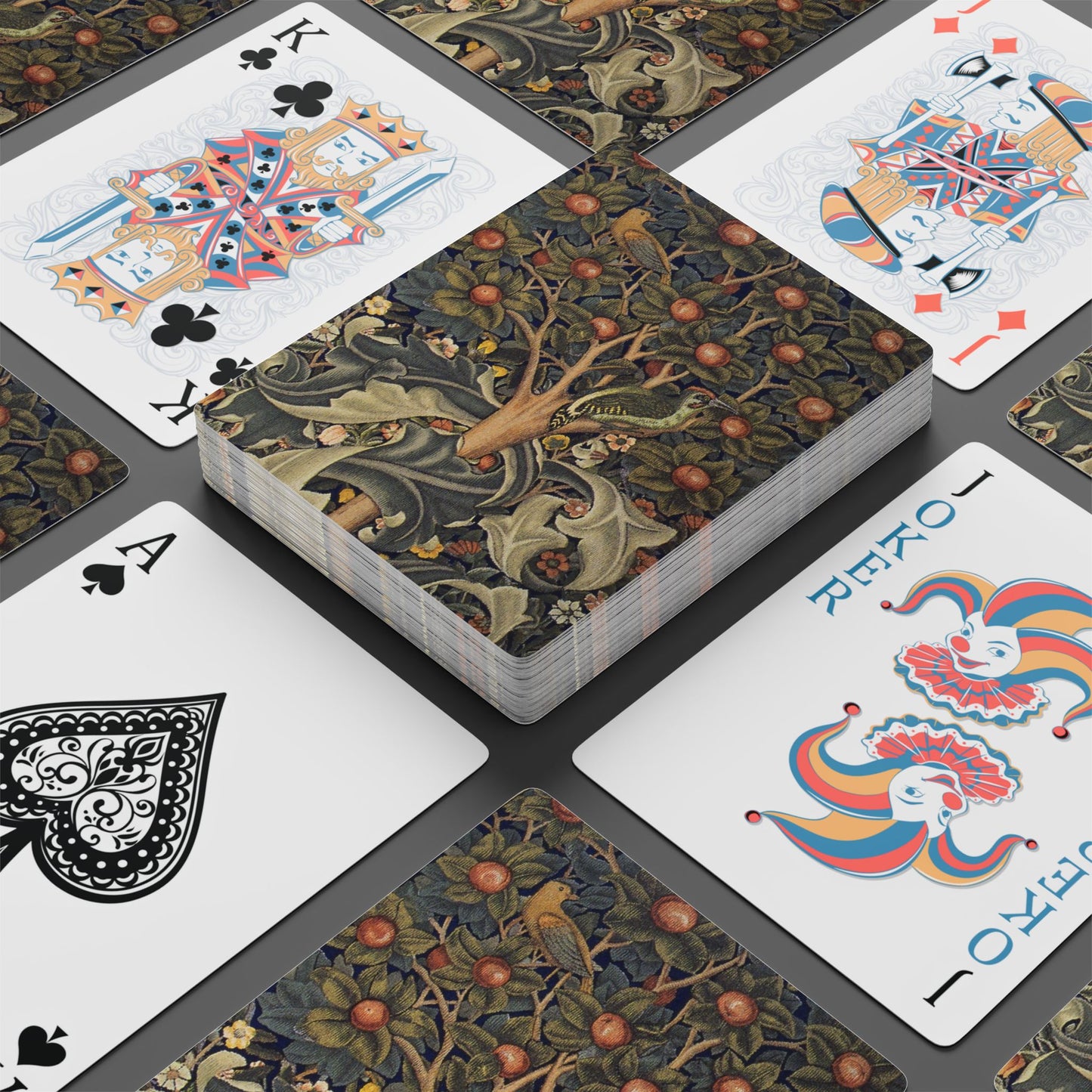 Playing cards with intricate designs on a gray surface