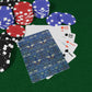 Poker chips and playing cards on a green felt surface