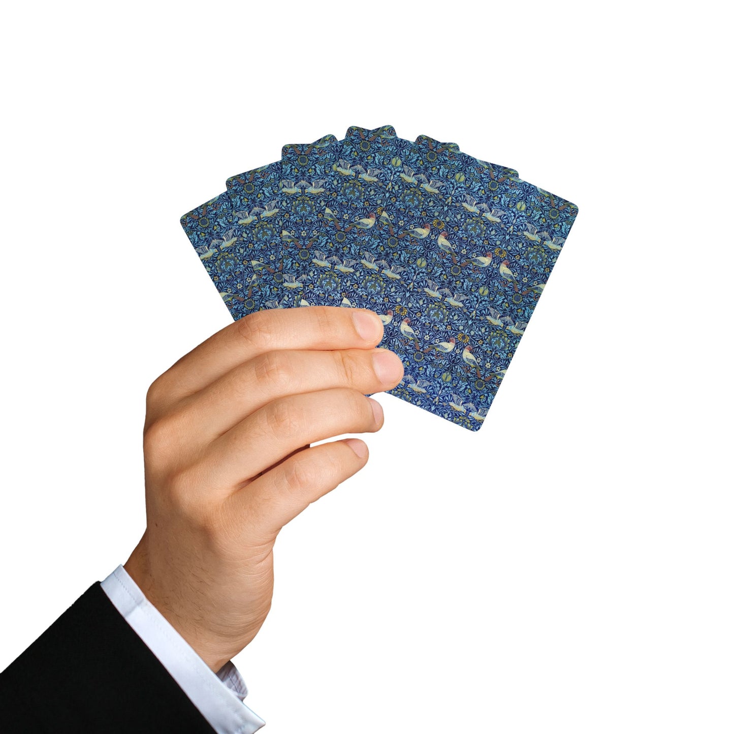 Hand holding a deck of blue playing cards with a pattern on a white background