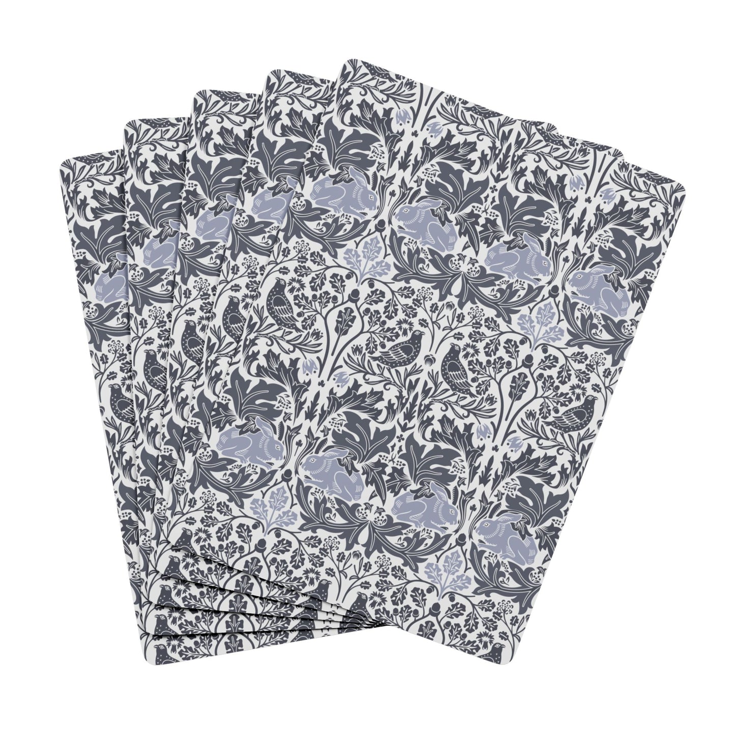 Set of playing cards with a floral pattern on a white background