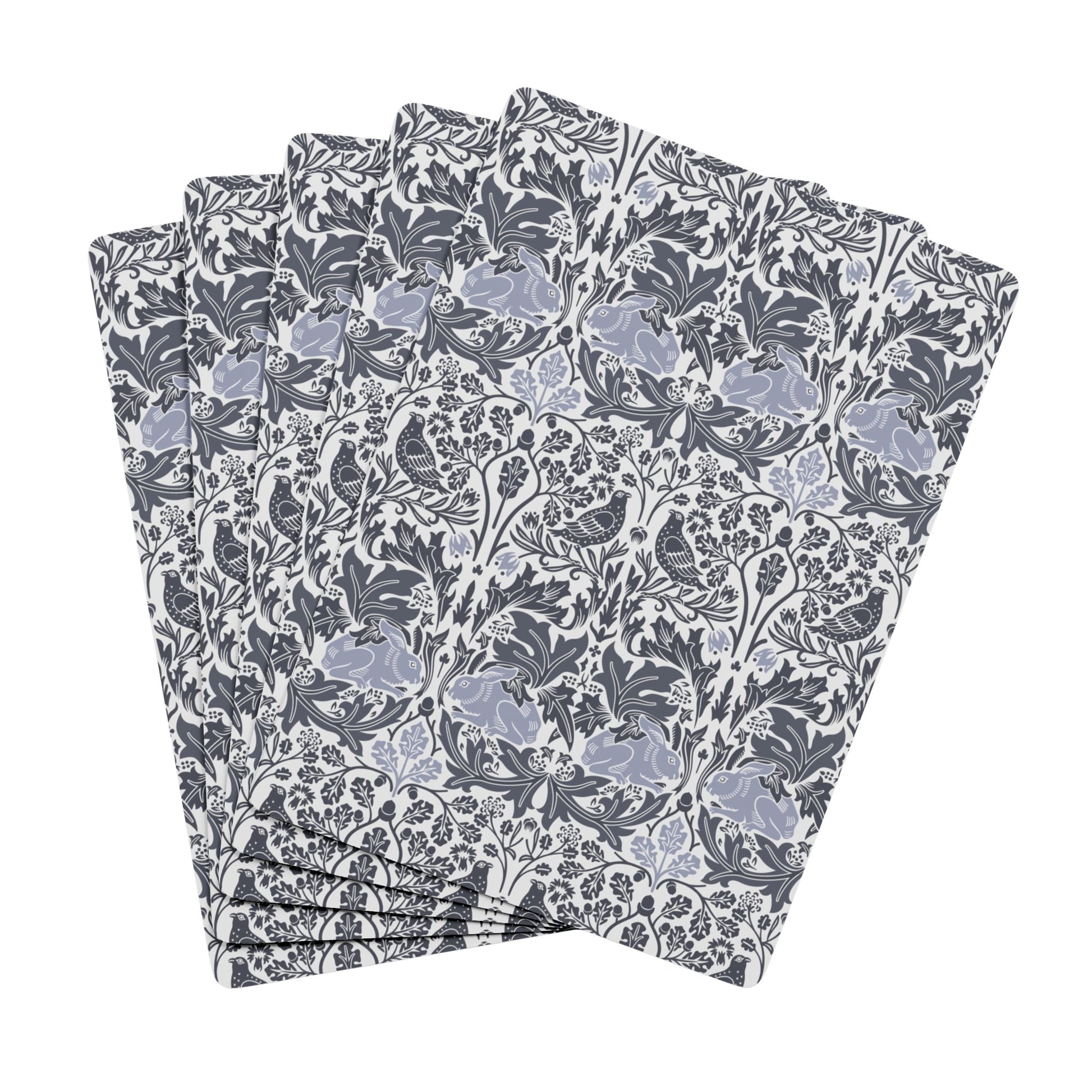 Set of playing cards with a floral pattern on a white background