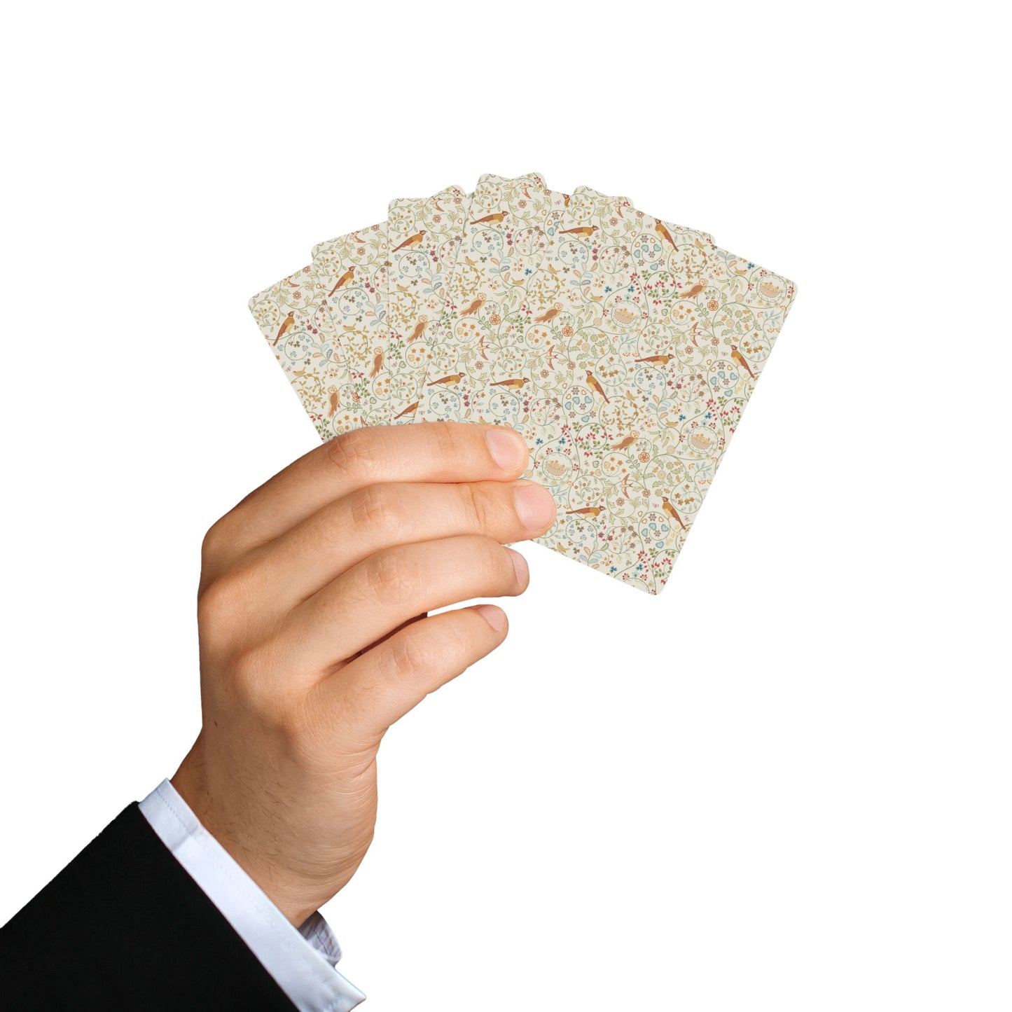 Hand holding a deck of playing cards against a white background