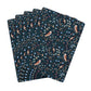 Set of dark blue playing cards with nature-themed pattern on a white background