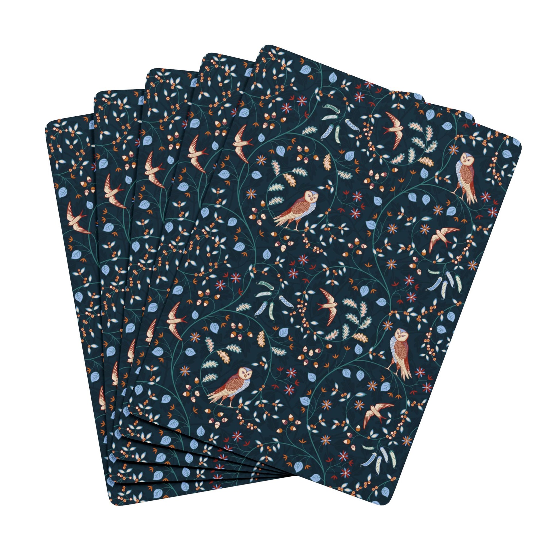 Set of dark blue playing cards with nature-themed pattern on a white background
