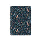 Patterned playing cards with owls and floral designs on a dark blue background