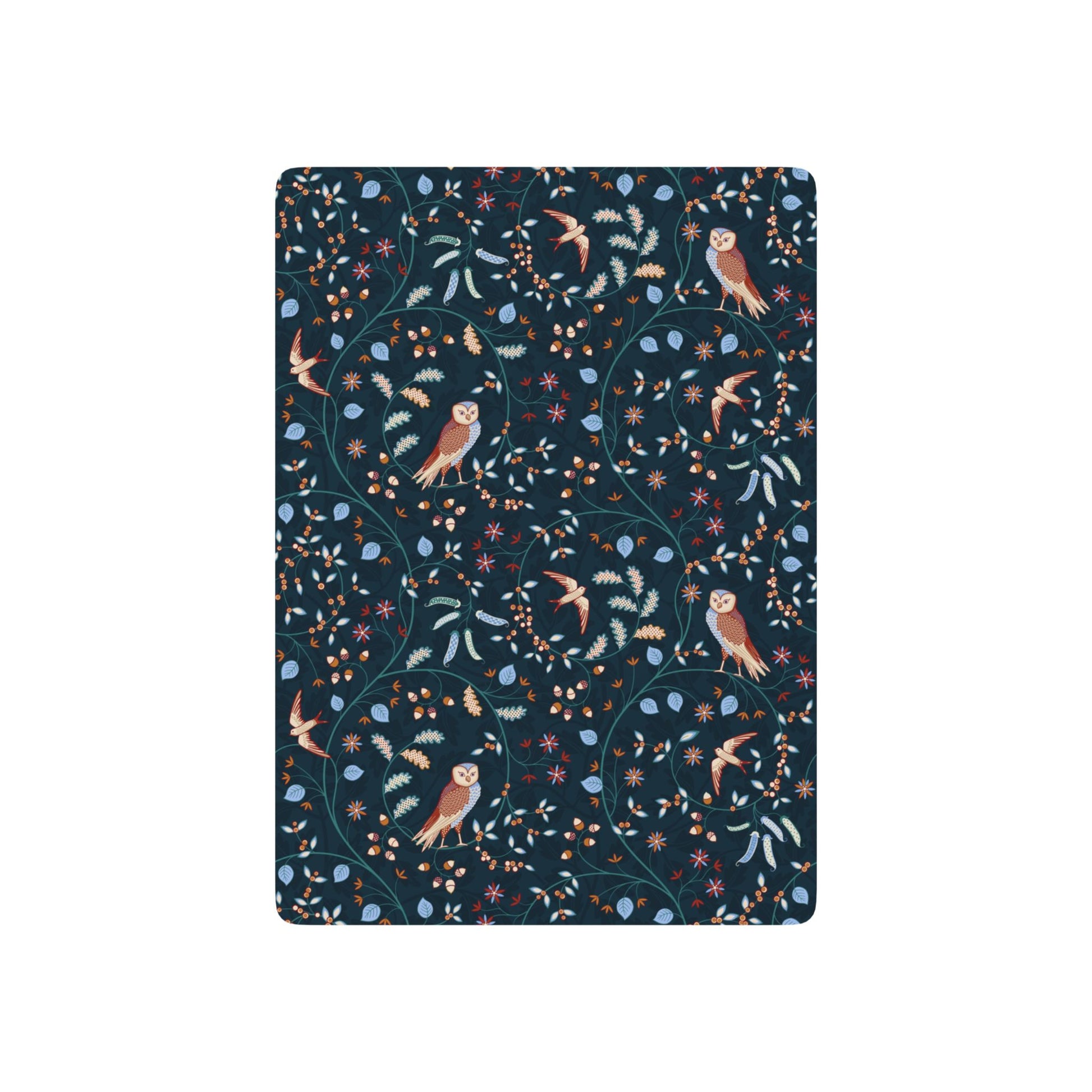 Patterned playing cards with owls and floral designs on a dark blue background