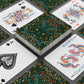 Playing cards with floral design on a gray surface