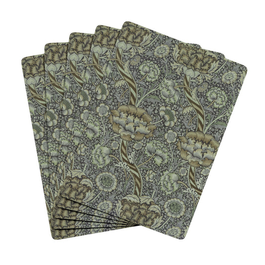 Set of floral patterned playing cards on a white background