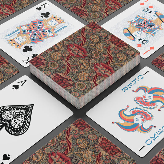 Playing cards with decorative backs on a gray surface
