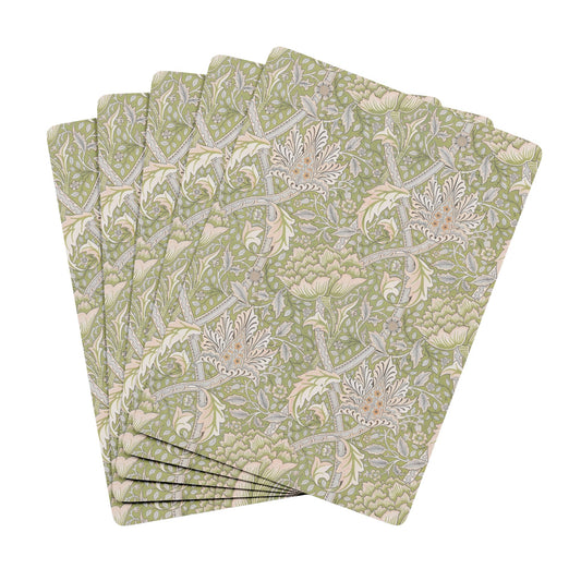 Set of four floral patterned napkins on a white background