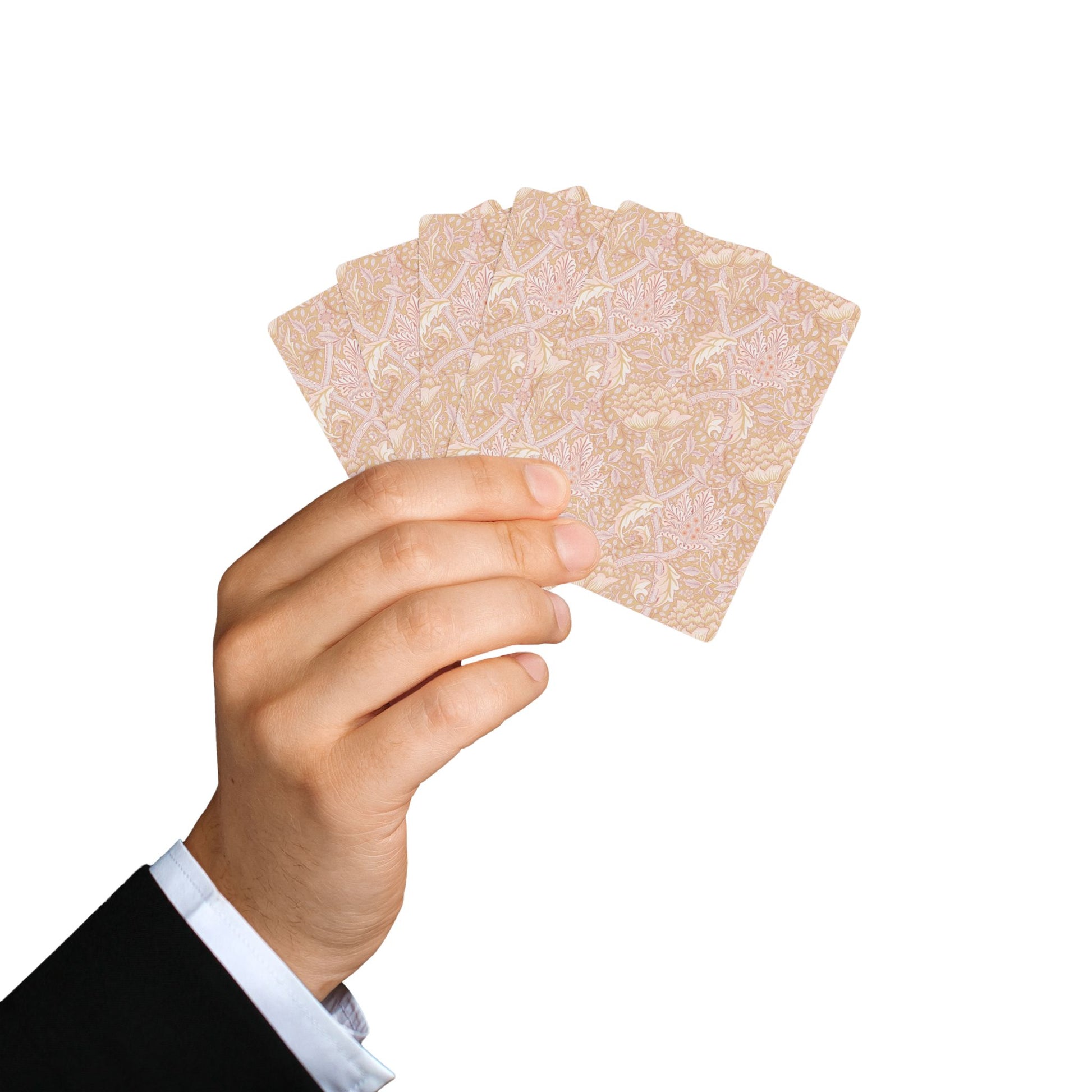 Hand holding a set of playing cards against a white background