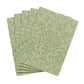 Set of green patterned paper sheets on a white background