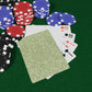 Poker chips and playing cards on a green felt surface