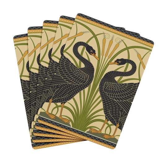 Set of playing cards with black swan design on a beige background