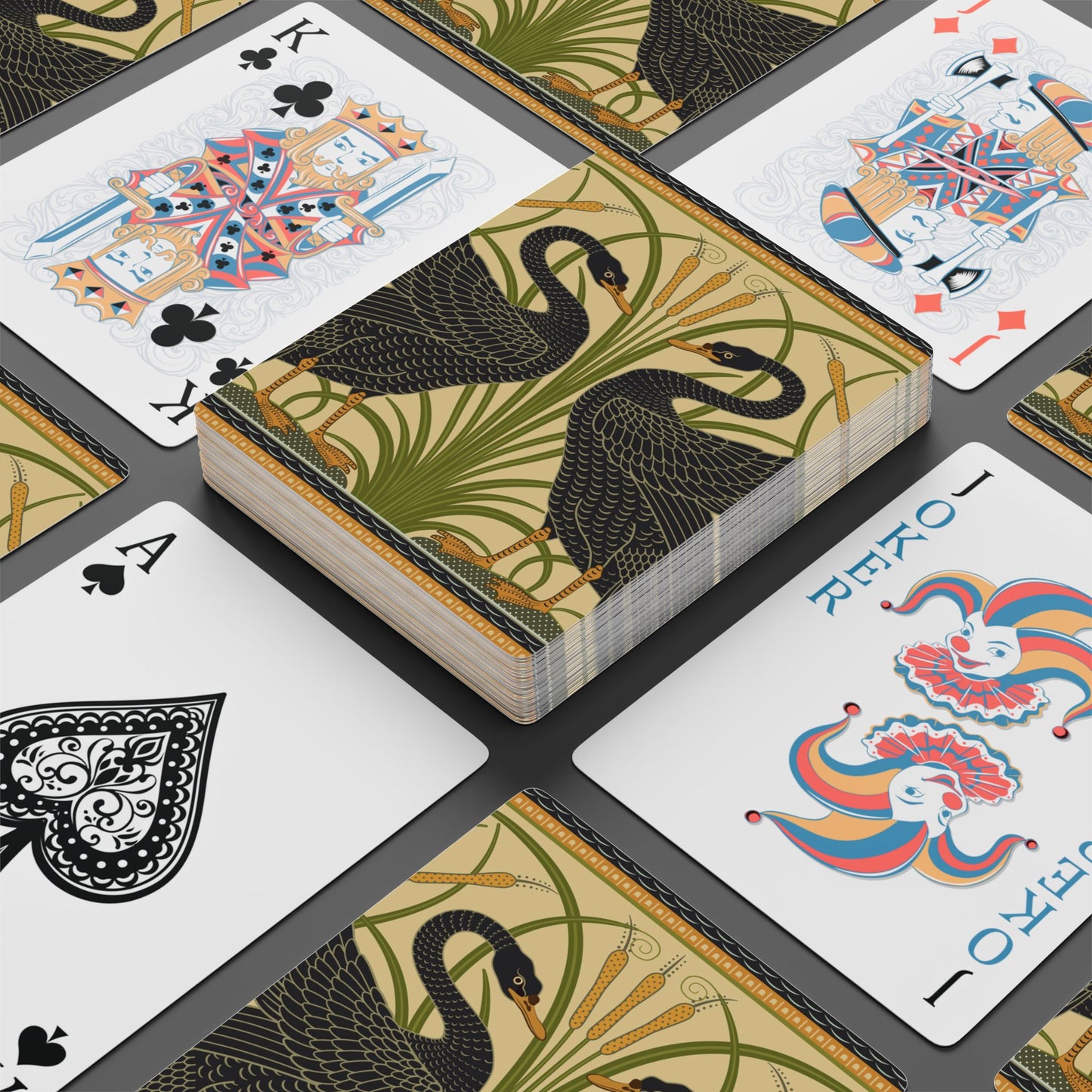 Playing cards with decorative designs on a black background