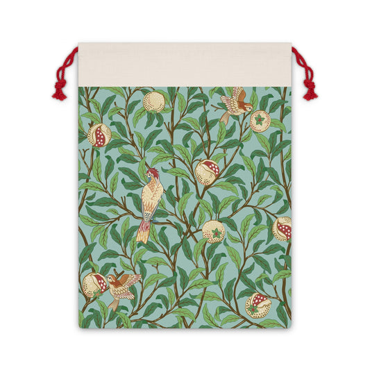 A Christmas Santa sack with a blue background featuring an intricate design with birds and pomegranates, with red drawstrings at the top.