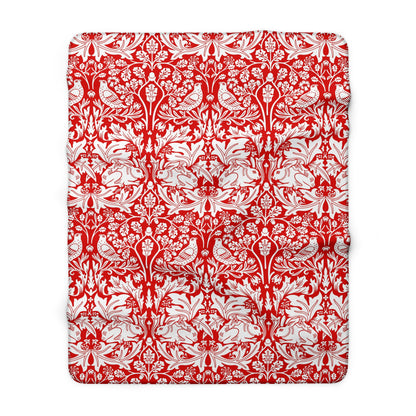 Red and white floral and bird pattern on a white background