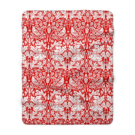 Red and white floral and bird pattern on a white background
