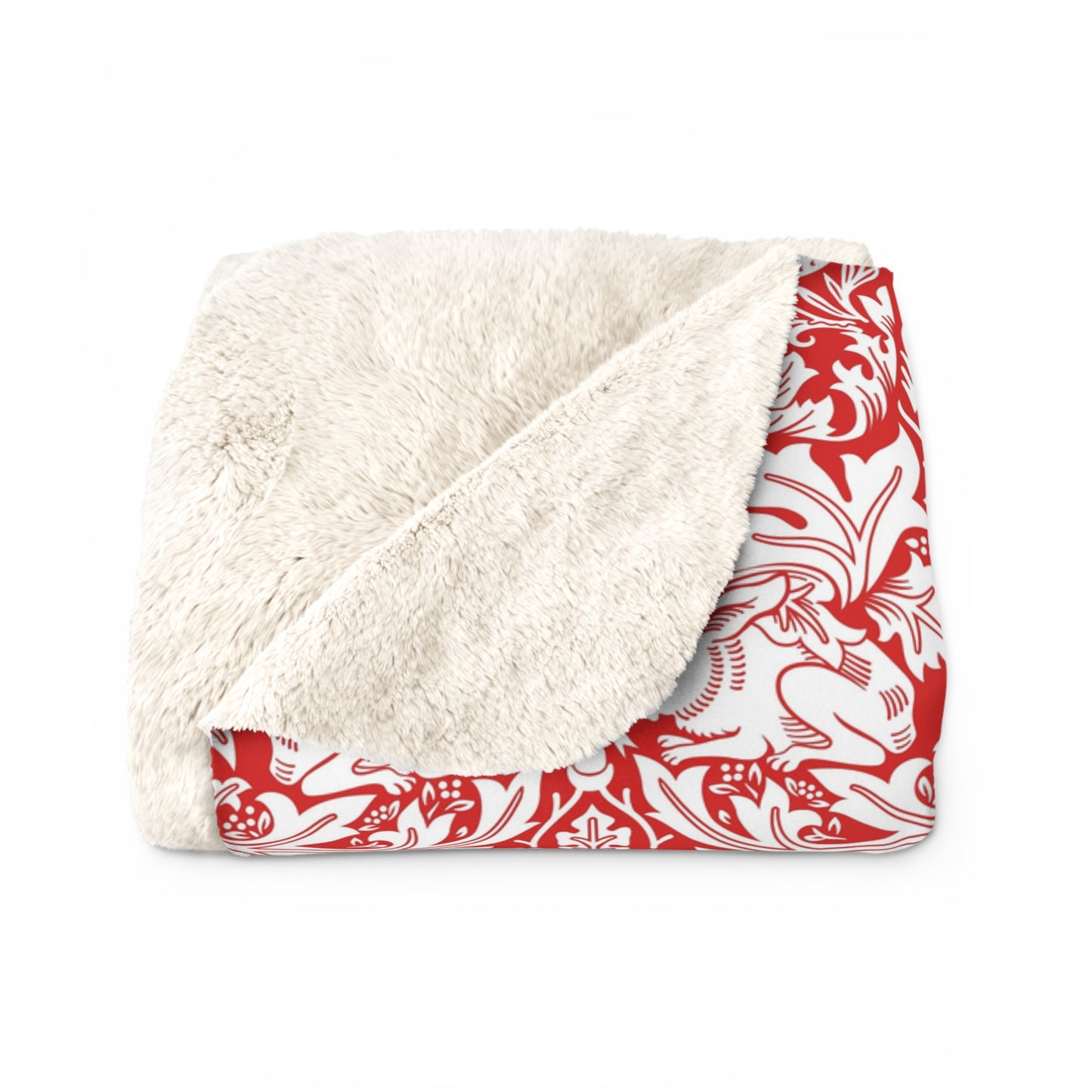 Blanket with white sherpa interior and red floral exterior on a white background