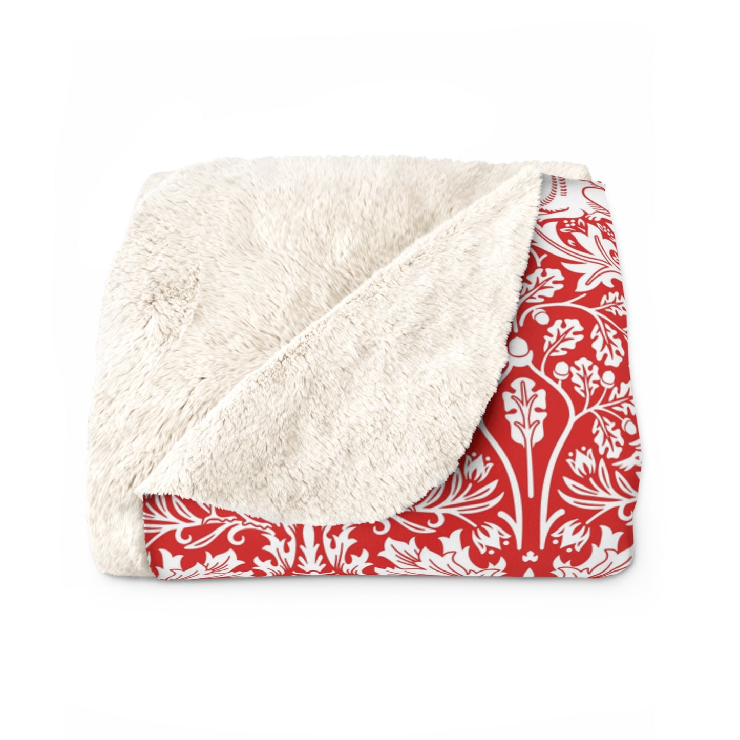 Blanket with white sherpa interior and red floral exterior on a white background