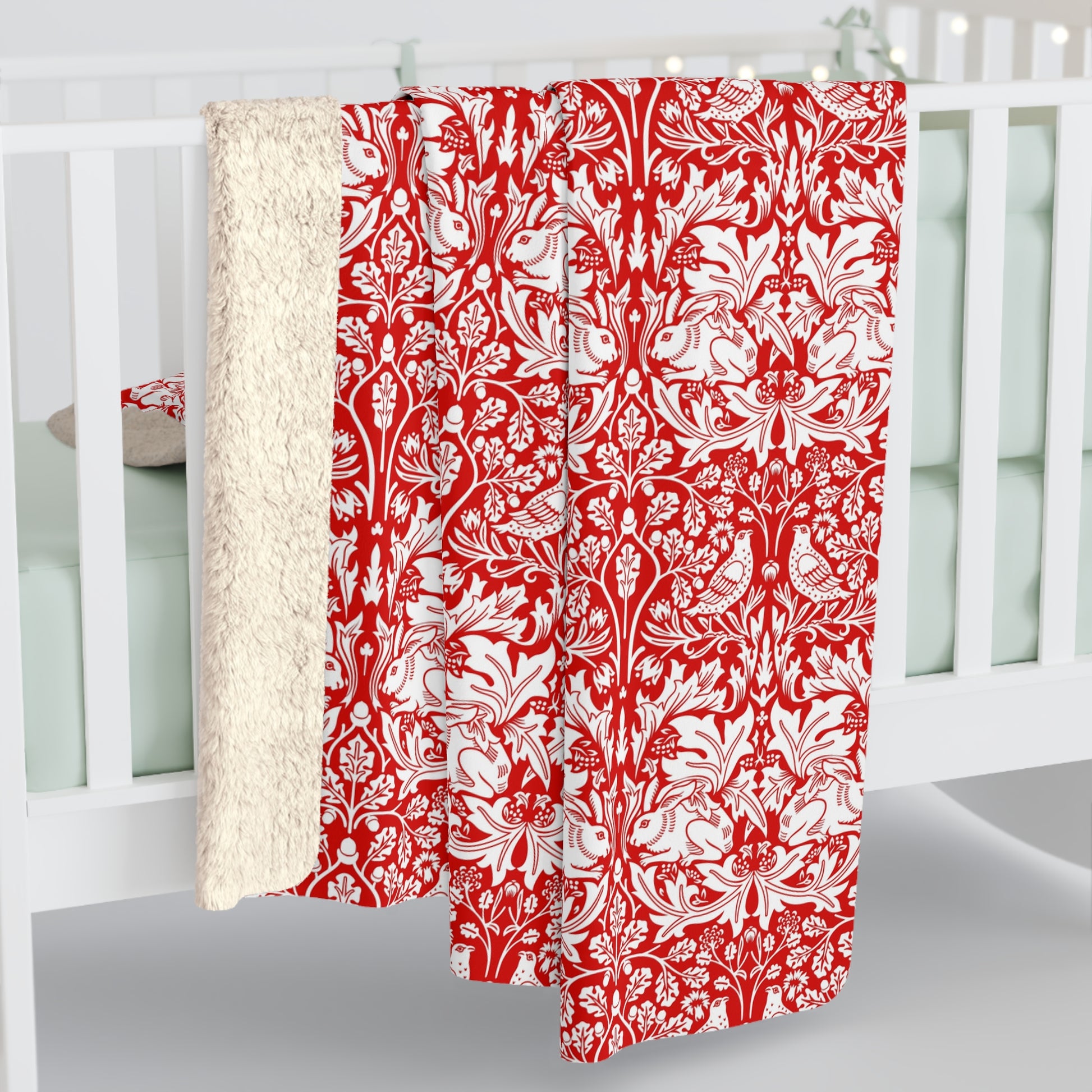 Red and white floral patterned curtain hanging in front of a white window frame.