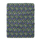 Floral patterned blanket with blue flowers on a green background