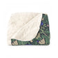 Floral patterned blanket with white fleece on a white background
