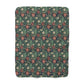 Floral patterned fabric with red flowers and green leaves on a white background