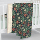 Floral patterned blanket draped over a crib