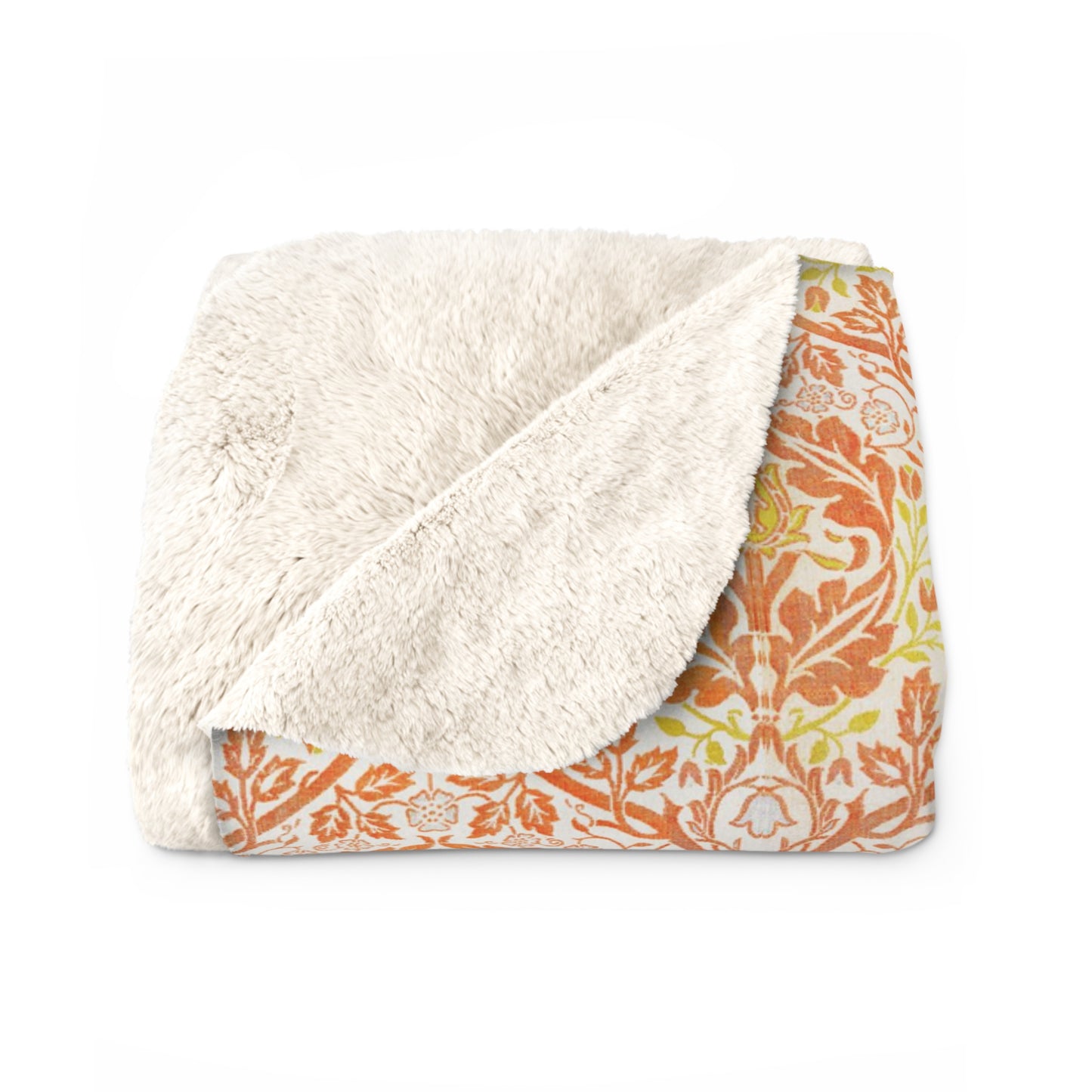 A plush fleece blanket with a geometric pattern in orange and cream colors, laid out flat.
